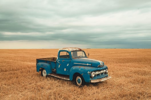 blue-single-cab-farm-truck-on-brown-grassland-2961048